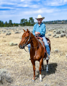 Ward Fenton riding a Quarter Horse